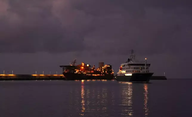 The hantavirus-stricken cruise ship MV Hondius is seen at anchor after arriving at the port of Granadilla in Tenerife, Canary Islands, Spain, Sunday, May 10, 2026. (AP Photo/Manu Fernandez)