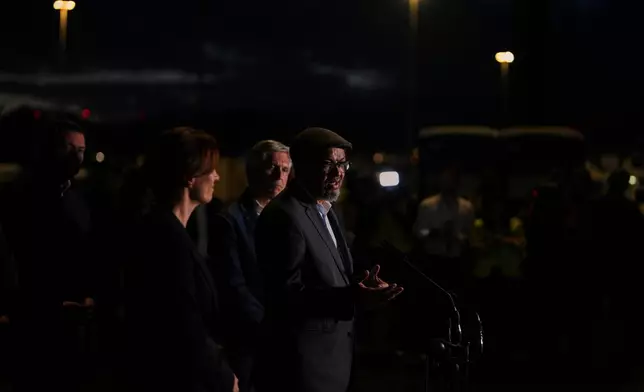 Tedros Adhanom Ghebreyesus, Director-General of the World Health Organization, speaks to the media near the area where passengers from the MV Hondius are expected to arrive at the port of Port of Granadilla in Tenerife, Saturday, May 9, 2026. (AP Photo/Manu Fernandez)