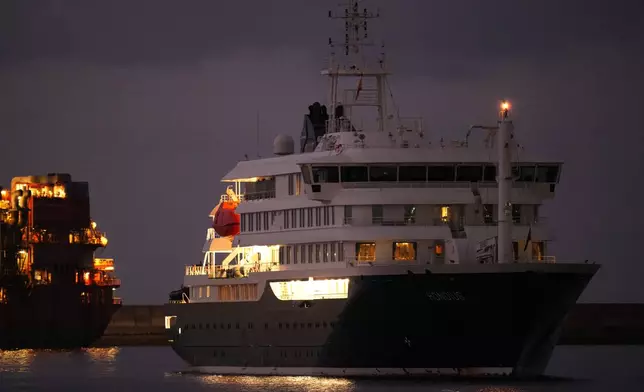 The hantavirus-stricken cruise ship MV Hondius is seen at anchor after arriving at the port of Granadilla in Tenerife, Canary Islands, Spain, Sunday, May 10, 2026. (AP Photo/Manu Fernandez)