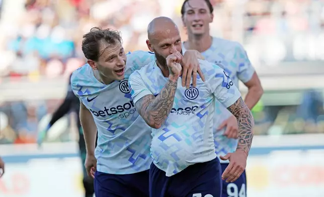 Inter's Federico Dimarco celebrates scoring, during the Serie A soccer match between Bologna and Inter Milan, in Bologna, Italy, Saturday, May 23, 2026. (Gianni Santandrea/LaPresse via AP)