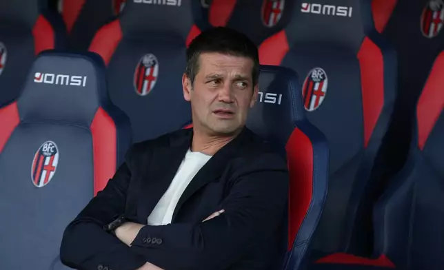 Inter Milan coach Cristian Chivu sits on the bench ahead of the Serie A soccer match between Bologna and Inter Milan, in Bologna, Italy, Saturday, May 23, 2026. (Gianni Santandrea/LaPresse via AP)