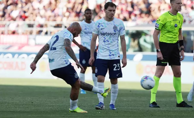 Inter's Federico Dimarco scores, during the Serie A soccer match between Bologna and Inter Milan, in Bologna, Italy, Saturday, May 23, 2026. (Gianni Santandrea/LaPresse via AP)