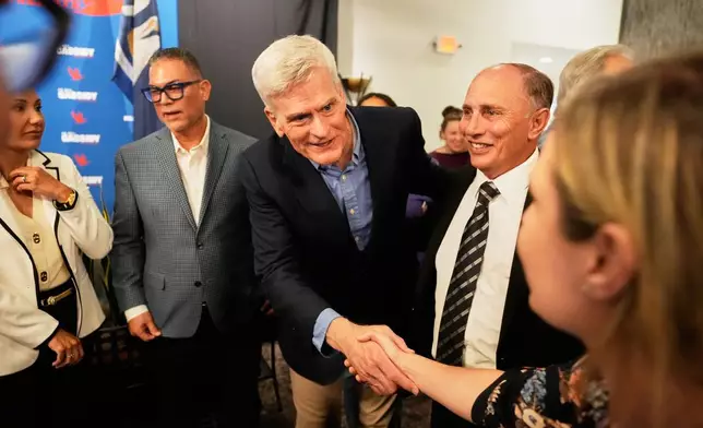 U.S. Sen. Bill Cassidy, R-La., greets supporters at a campaign stop at Drago's Restaurant Tuesday, May 5, 2026, in Metairie, La. (AP Photo/Gerald Herbert)