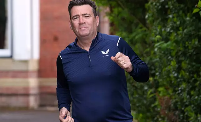 The Mayor of Greater Manchester, Andy Burnham, starts a morning run in Manchester, England, Monday, May 18, 2026 whilst Britain's government is in turmoil, and some see Andy Burnham as the one to save it. (AP Photo/Jon Super)