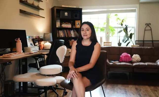 Elsa Sanchez, whose working permit expired because of DACA renewal delays, poses for a photo on Wednesday, April 29, 2026, in Atlanta. (AP Photo/Emilie Megnien)