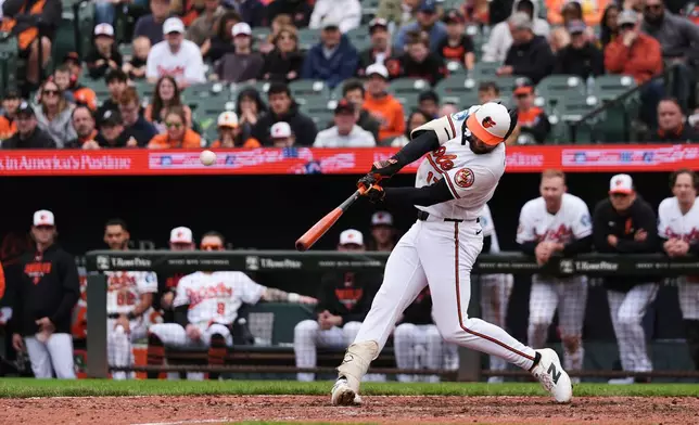 Baltimore Orioles' Colton Cowser hits a walkoff three-run home run during the ninth inning in the first baseball game of a doubleheader against the Detroit Tigers, Sunday, May 24, 2026, in Baltimore. (AP Photo/Stephanie Scarbrough)