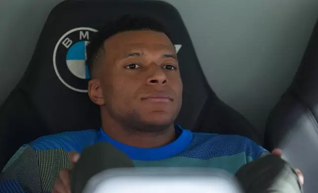Real Madrid's Kylian Mbappe looks out from the bench prior to the Spanish La Liga soccer match between Real Madrid and Real Oviedo in Madrid, Spain, Thursday, May 14, 2026. (AP Photo/Manu Fernandez)