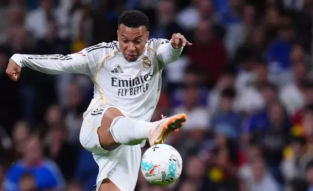 Real Madrid's Kylian Mbappe kicks the ball during the Spanish La Liga soccer match between Real Madrid and Real Oviedo in Madrid, Spain, Thursday, May 14, 2026. (AP Photo/Manu Fernandez)