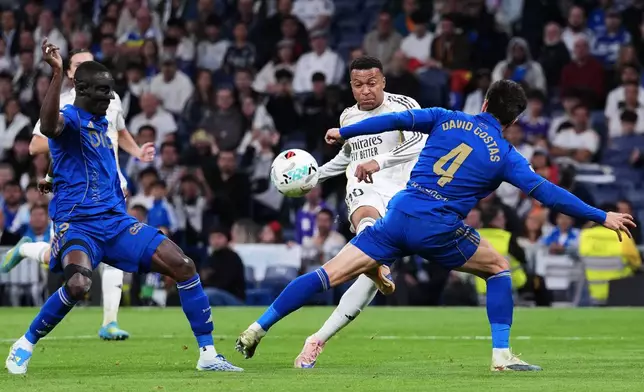 Real Oviedo's David Costas, front right, tries to block a shot from Real Madrid's Kylian Mbappe during the Spanish La Liga soccer match between Real Madrid and Real Oviedo in Madrid, Spain, Thursday, May 14, 2026. (AP Photo/Manu Fernandez)