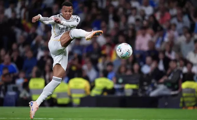 Real Madrid's Kylian Mbappe kicks the ball during the Spanish La Liga soccer match between Real Madrid and Real Oviedo in Madrid, Spain, Thursday, May 14, 2026. (AP Photo/Manu Fernandez)
