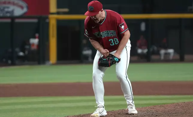 Arizona Diamondbacks pitcher Paul Sewald celebrates after defeating the Colorado Rockies during a baseball game, Saturday, May 23, 2026, in Phoenix. (AP Photo/Rick Scuteri)