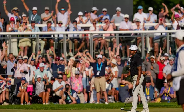 Aaron Rai, of England, celebrates after his shot on the 17th green during the final round of the PGA Championship golf tournament at Aronimink Golf Club, Sunday, May 17, 2026, in Newtown Square, PA. (AP Photo/Carolyn Kaster)