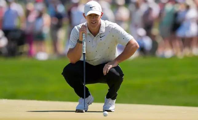 Rory McIlroy, of Northern Ireland, lines up his shot on the 16th green during the third round of the PGA Championship golf tournament at Aronimink Golf Club, Saturday, May 16, 2026, in Newtown Square, PA. (AP Photo/Frank Franklin II)