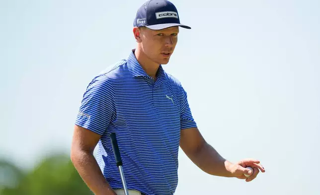 Matti Schmid, of Germany, waves on the third green during the final round of the PGA Championship golf tournament at Aronimink Golf Club, Sunday, May 17, 2026, in Newtown Square, PA. (AP Photo/Frank Franklin II)