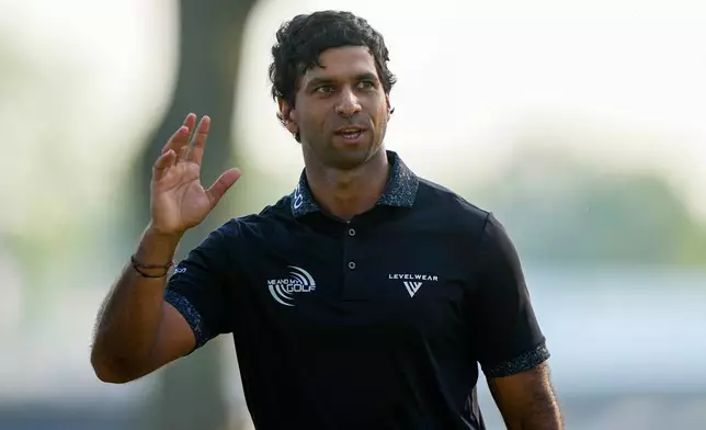 Aaron Rai, of England, waves on the 18th green after his round during the final round of the PGA Championship golf tournament at Aronimink Golf Club, Sunday, May 17, 2026, in Newtown Square, PA. (AP Photo/Matt Slocum)