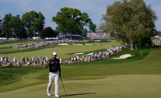 Aaron Rai, of England, waves on the 10th green during the final round of the PGA Championship golf tournament at Aronimink Golf Club, Sunday, May 17, 2026, in Newtown Square, PA. (AP Photo/Matt Slocum)