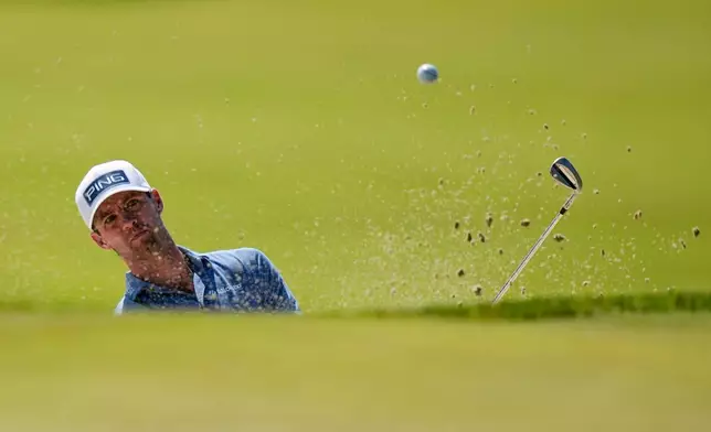 Alex Smalley hits from the bunker on the third green during the final round of the PGA Championship golf tournament at Aronimink Golf Club, Sunday, May 17, 2026, in Newtown Square, PA. (AP Photo/Frank Franklin II)