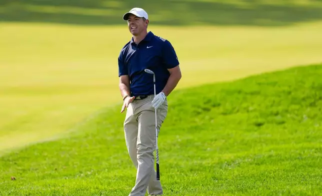 Rory McIlroy, of Northern Ireland, watches his shot on the 11th fairway during the final round of the PGA Championship golf tournament at Aronimink Golf Club, Sunday, May 17, 2026, in Newtown Square, PA. (AP Photo/Carolyn Kaster)