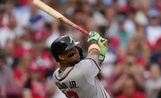 Atlanta Braves right fielder Ronald Acuña Jr. watches his solo home run during the third inning of a baseball game against the Cincinnati Reds in Cincinnati, Saturday, May 30, 2026. (AP Photo/Carolyn Kaster)