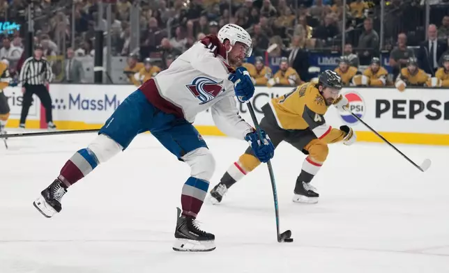 Colorado Avalanche center Brock Nelson (11) shoots the puck during the first period in Game 4 of the Western Conference finals NHL hockey Stanley Cup playoff series against the Vegas Golden Knights Tuesday, May 26, 2026, in Las Vegas. (AP Photo/John Locher)
