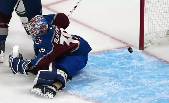 Colorado Avalanche goaltender MacKenzie Blackwood allows a goal by Minnesota Wild left wing Marcus Johansson in the first period of Game 5 of an NHL Stanley Cup hockey second-round playoff series, Wednesday, May 13, 2026, in Denver. (AP Photo/David Zalubowski)