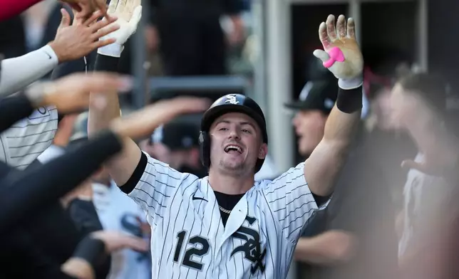 Chicago White Sox's Colson Montgomery (12) celebrates after hitting a two-run home run during the first inning of a baseball game against the Seattle Mariners, Saturday, May 9, 2026, in Chicago. (AP Photo/Erin Hooley)