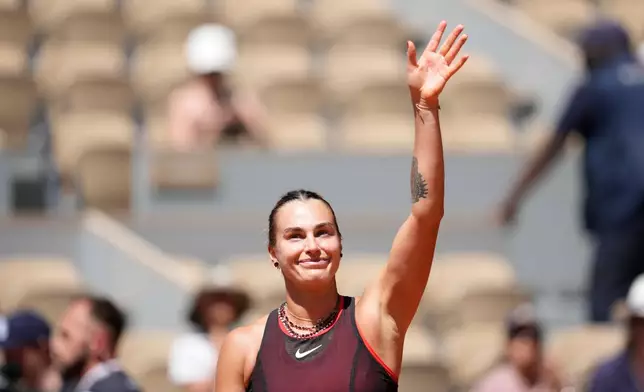 Aryna Sabalenka of Belarus celebrates after winning against Jessica Bouzas Maneiro of Spain during their first round women's singles tennis match at the French Open tennis tournament in Paris, Tuesday, May 26, 2026. (AP Photo/Christophe Ena)