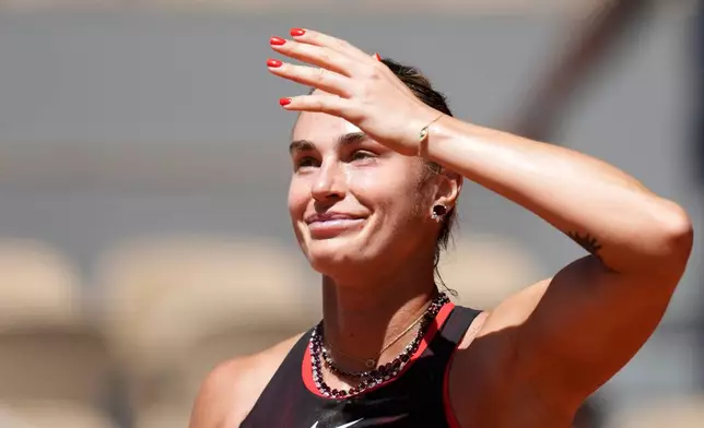Aryna Sabalenka of Belarus celebrates after winning against Jessica Bouzas Maneiro of Spain during their first round women's singles tennis match at the French Open tennis tournament in Paris, Tuesday, May 26, 2026. (AP Photo/Christophe Ena)