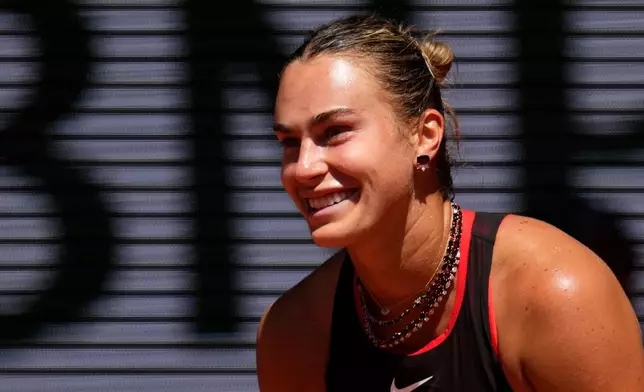 Aryna Sabalenka of Belarus reacts as she plays against Jessica Bouzas Maneiro of Spain during their first round women's singles tennis match at the French Open tennis tournament in Paris, Tuesday, May 26, 2026. (AP Photo/Christophe Ena)