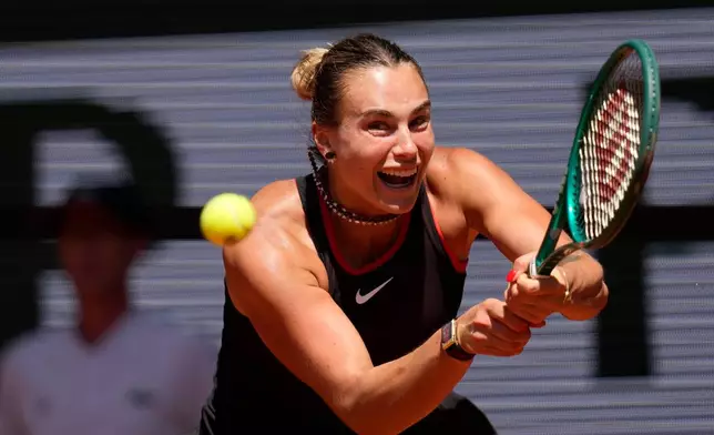 Aryna Sabalenka of Belarus returns to Jessica Bouzas Maneiro of Spain during their first round women's singles tennis match at the French Open tennis tournament in Paris, Tuesday, May 26, 2026. (AP Photo/Christophe Ena)