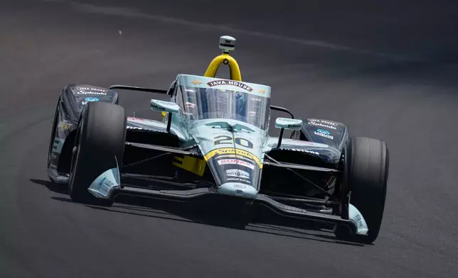 Alexander Rossi drives through the third turn during qualifications for the Indianapolis 500 auto race at the Indianapolis Motor Speedway in Indianapolis, Sunday, May 17, 2026. (AP Photo/Michael Conroy)