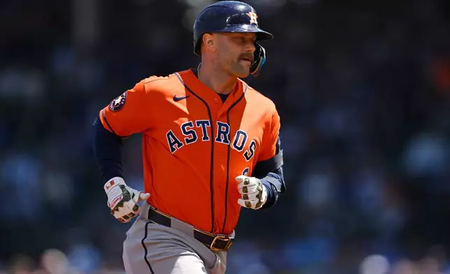 Houston Astros' Christian Walker rounds the bases after hitting a two-run home run during the first inning of a baseball game against the Chicago Cubs in Chicago, Saturday, May 23, 2026. (AP Photo/Paul Beaty)