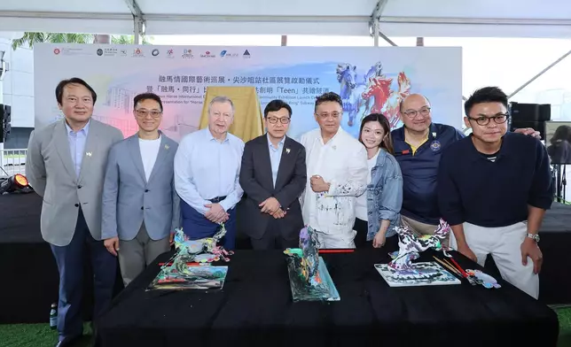 Guests joined hands to paint mini horse sculptures at the launch ceremony.