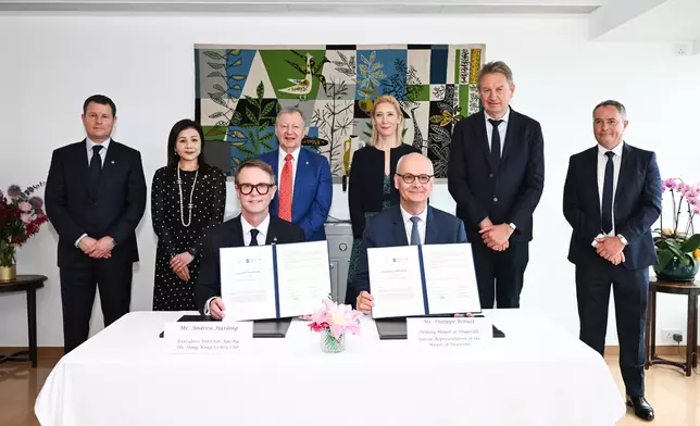 The Hong Kong Jockey Club and the city of Deauville, represented by Andrew Harding, HKJC Executive Director, Racing (front row, left) and Philippe Béhuet, Deputy Mayor of Deauville and Special Representative of the Mayor of Deauville (front row, right), sign a Memorandum of Understanding to strengthen collaboration in the fields of equine sport development. The signing is witnessed by Christile Drulhe, Consul General of France in Hong Kong and Macau (back row, 3rd right); Winfried Engelbrecht-Bresges, HKJC Chief Executive Officer (back row, 3rd left); Frank Lemestre, Director of the Deauville International Equestrian Centre (back row, 2nd right); Thierry Bottard, Director General of InDeauville (back row, 1st right); Terecina Kwong, HKJC Executive Director, Membership and Customer Excellence (back row, 2nd left); and Casper Stylsvig, HKJC Executive Director, Sports Business (back row, 1st left).
