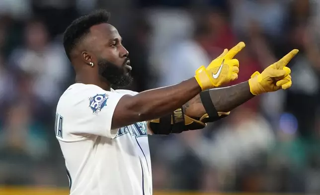 Seattle Mariners' Randy Arozarena reacts after hitting a double against the Chicago White Sox during the sixth inning of a baseball game, Monday, May 18, 2026, in Seattle. (AP Photo/Lindsey Wasson)