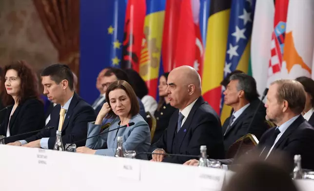 Moldova's President Maia Sandu, center, Secretary General of the Council of Europe Alain Berset, right, and Moldova's Deputy Prime Minister and Minister of Foreign Affairs Mihai Popsoi attend the 135th Ministerial Session of the Committee of Ministers of the Council of Europe in Chisinau, Moldova, Friday, May 15, 2026. (AP Photo/Elena Covalenco)