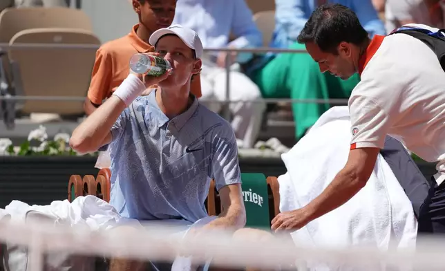Jannik Sinner of Italy drinks during a break at the second round men's singles tennis match against Juan Manuel Cerundolo of Argentina at the French Open tennis tournament in Paris, Thursday, May 28, 2026. (AP Photo/Thibault Camus)