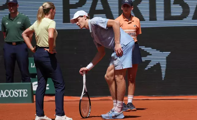 Jannik Sinner of Italy talks with the referee during the second round men's singles tennis match against Juan Manuel Cerundolo of Argentina at the French Open tennis tournament in Paris, Thursday, May 28, 2026. (AP Photo/Thibault Camus)