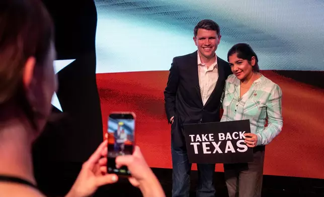 Texas state Rep. and Democratic Senate candidate James Talarico takes a photo with a supporter during a rally in Houston, Wednesday, May 27, 2026. (AP Photo/Joel Angel Juarez)