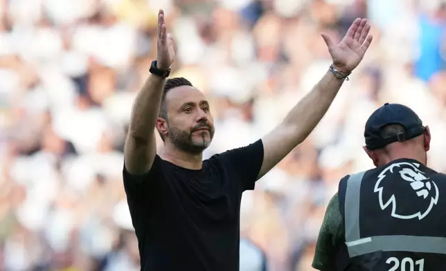Tottenham's head coach Roberto De Zerbi greets fans after the English Premier League soccer match between Tottenham Hotspur and Everton in London, England, Sunday, May 24, 2026. (AP Photo/Frank Augstein)