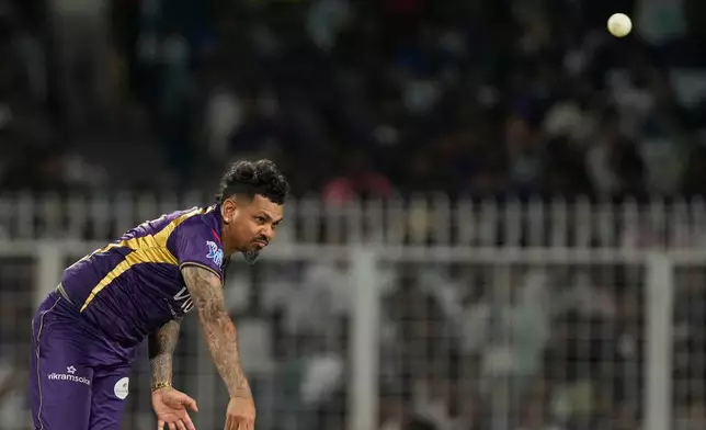 Kolkata Knight Riders' Sunil Narine bowls a delivery during the Indian Premier League cricket match between Gujarat Titans and Kolkata Knight Riders, in Kolkata , India, Saturday, May 16, 2026. (AP Photo/Bikas Das)