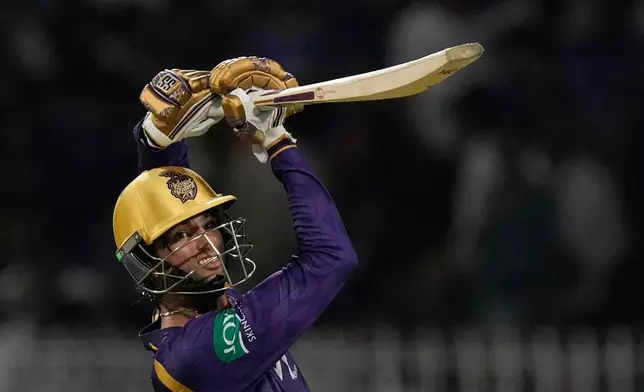 Kolkata Knight Riders' Angkrish Raghuvanshi hits a six during the Indian Premier League cricket match between Gujarat Titans and Kolkata Knight Riders, in Kolkata , India, Saturday, May 16, 2026. (AP Photo/Bikas Das)