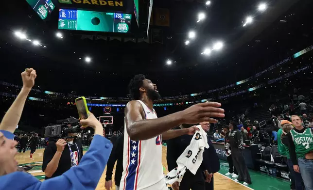 Philadelphia 76ers' Joel Embiid celebrates following his team's victory over the Boston Celtics after the Game 7 in a first-round NBA basketball playoffs series, Saturday, May 2, 2026 in Boston. (AP Photo/Jim Davis)