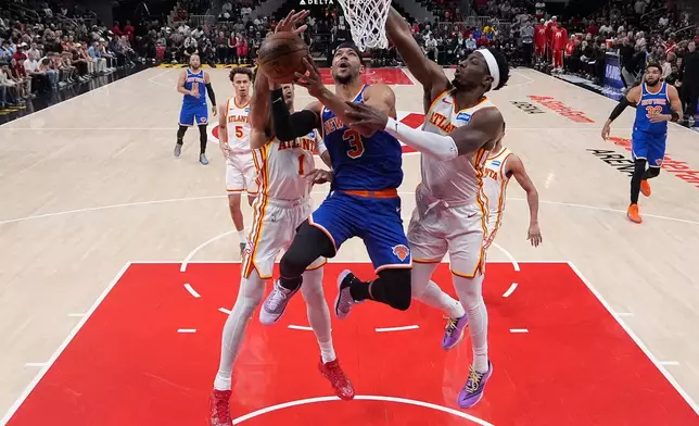 New York Knicks guard Josh Hart (3) shoots during Game 6 in a first-round NBA basketball playoffs series Thursday, April 30, 2026, in Atlanta. (AP Photo/Brynn Anderson)