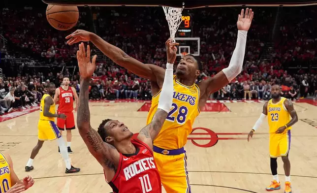 Los Angeles Lakers forward Rui Hachimura (28) blocks a shot by Houston Rockets forward Jabari Smith Jr. (10) during the first half of Game 6 of a first-round NBA playoffs basketball series in Houston, Friday, May 1, 2026. (AP Photo/Ashley Landis)
