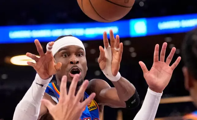Oklahoma City Thunder guard Shai Gilgeous-Alexander passes the ball during the second half of Game 3 in a second-round NBA basketball playoffs series against the Los Angeles Lakers, Saturday, May 9, 2026, in Los Angeles. (AP Photo/Mark J. Terrill)