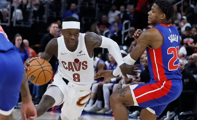 Cleveland Cavaliers guard Dennis Schroder (8) drives against Detroit Pistons guard Marcus Sasser during the second half of Game 7 in a second-round NBA basketball playoffs series, Sunday, May 17, 2026, in Detroit. (AP Photo/Duane Burleson)
