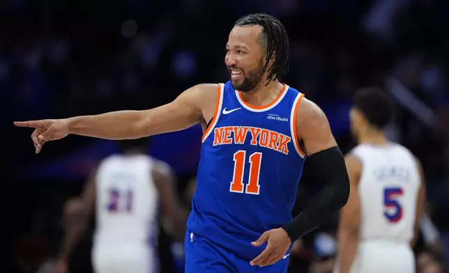 New York Knicks' Jalen Brunson reacts after scoring during the second half of Game 4 against the Philadelphia 76ers in a second-round NBA basketball playoffs series Sunday, May 10, 2026, in Philadelphia. (AP Photo/Matt Slocum)