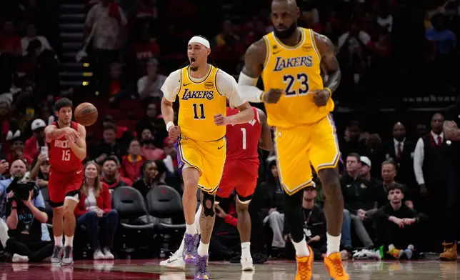 Los Angeles Lakers center Jaxson Hayes (11) celebrates during the second half of Game 6 of a first-round NBA playoffs basketball series against the Houston Rockets in Houston, Friday, May 1, 2026. (AP Photo/Ashley Landis)