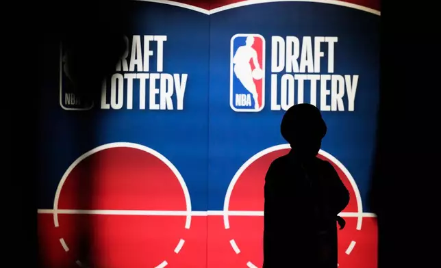 A person attends the NBA basketball draft lottery in Chicago, Sunday, May 10, 2026. (AP Photo/Nam Y. Huh)
